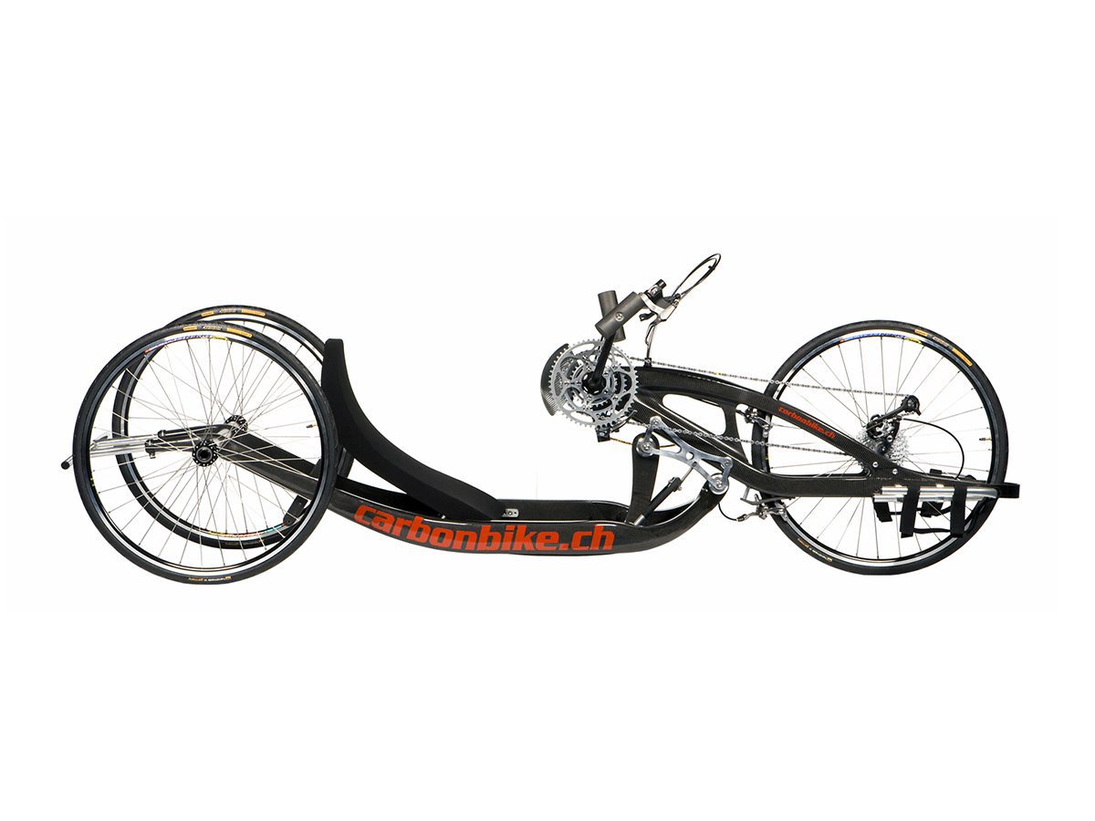 A black and orange tricycle on a white background.