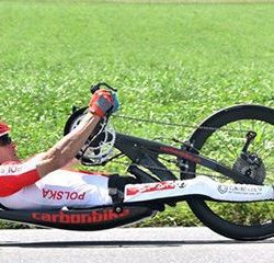A man riding a hand cycle in a high speed