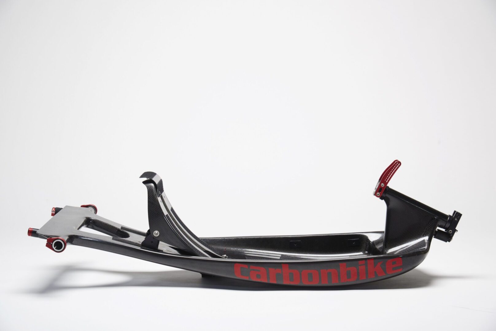 A black and red bike with the word carbonmobile on it.