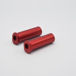 Two red aluminum H Axle insert long seat rods on a white background.