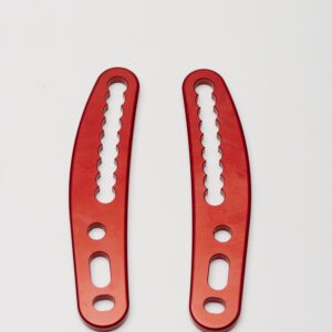 A pair of H-Fork to frame fine adjustment plate (RED) handles on a white surface.