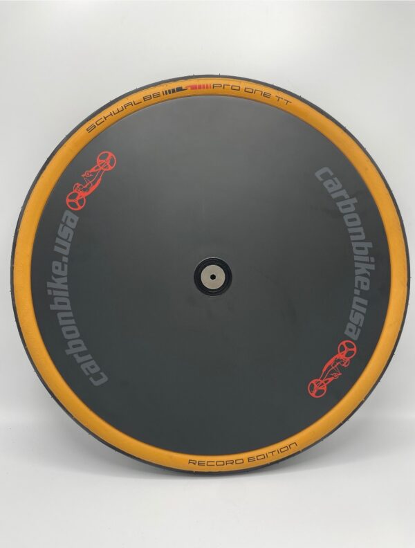 The HW-Carbonbike 20" threaded axle disc set is a black and orange bicycle wheel with a yellow rim.