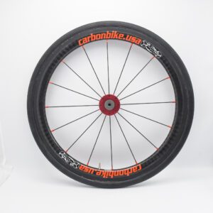 A HW-Carbonbike 20" carbon fiber rear wheel with red and orange lettering.